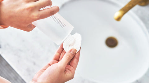 Woman applying toner