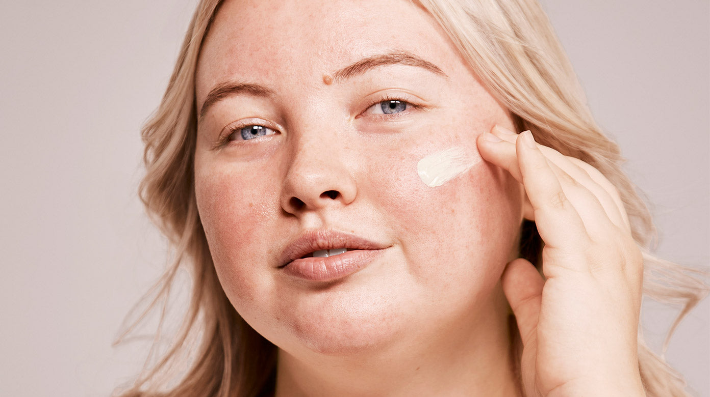 Woman wearing Rescue Balm +Red Correct