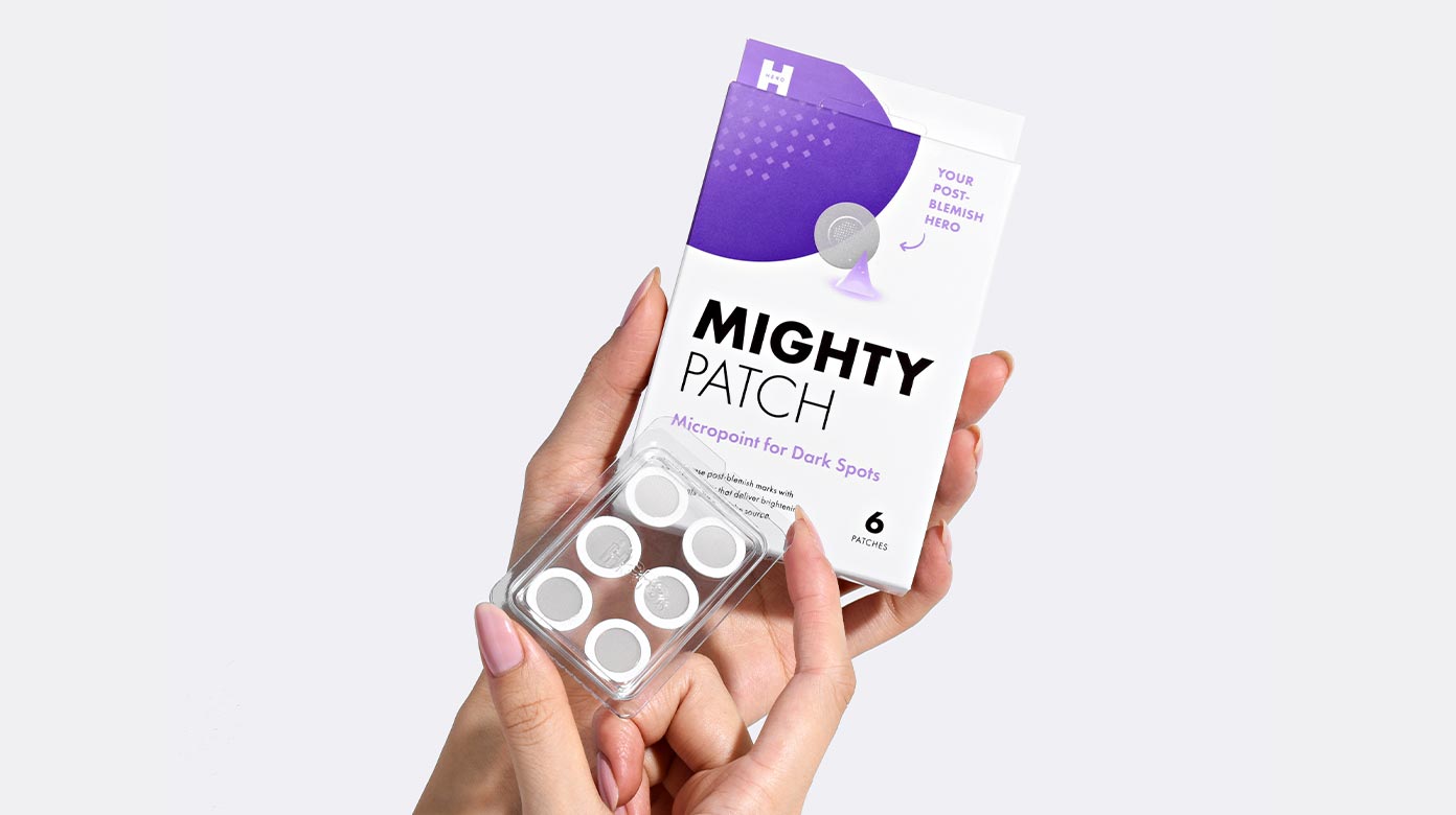 Hand holding Micropoint for Dark Spots