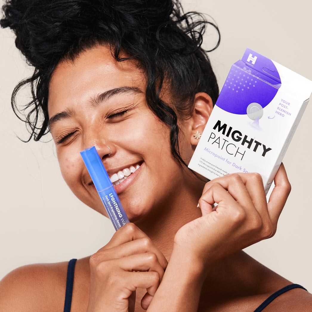 Manuela holding up lightning wand and micropoint for dark spots