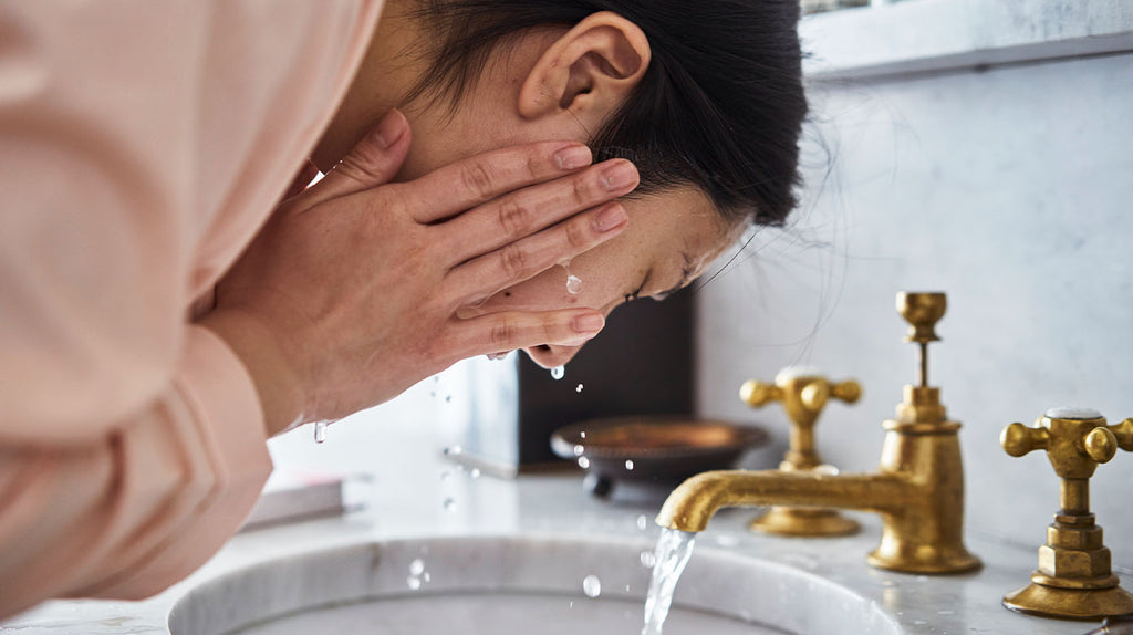 Woman washing face