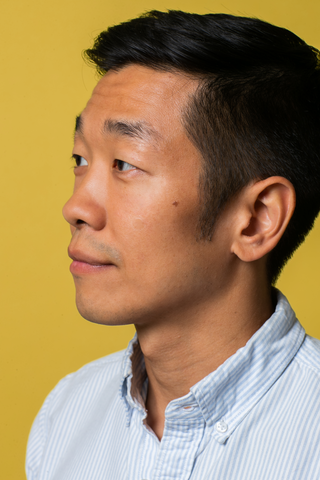 Asian male with Mighty Patch on cheek