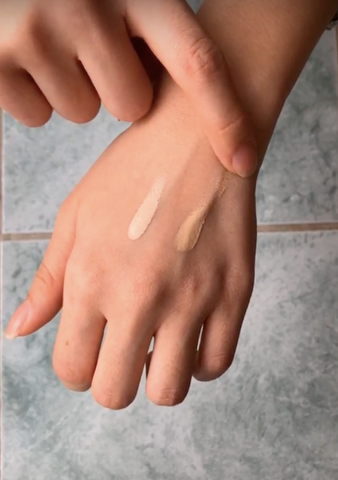 Hands with swatches of concealer